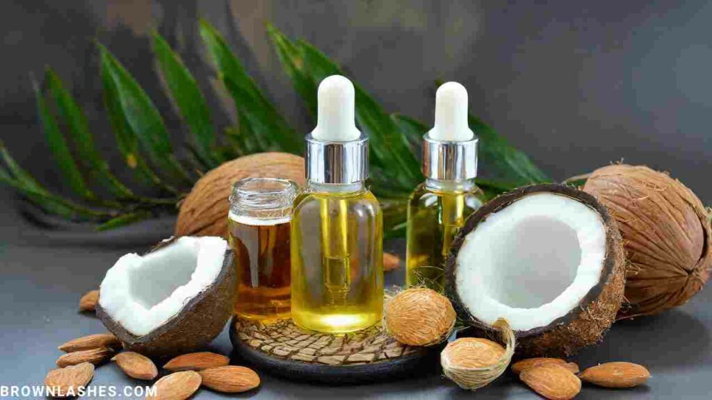 Bottles of castor oil, coconut oil, and almond oil, natural remedies for eyelash dryness.